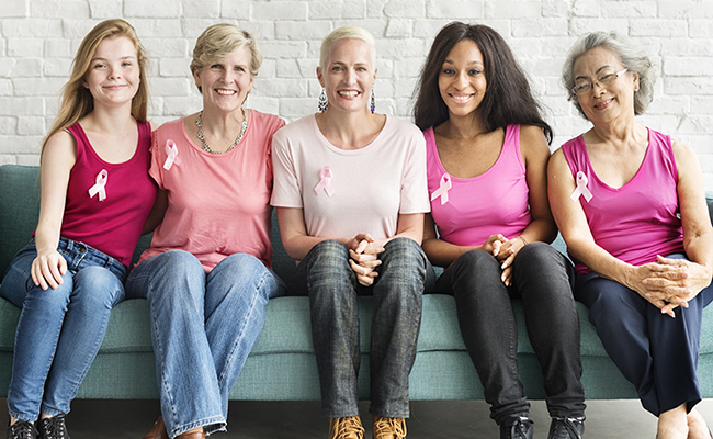 women wearing breast cancer ribbon