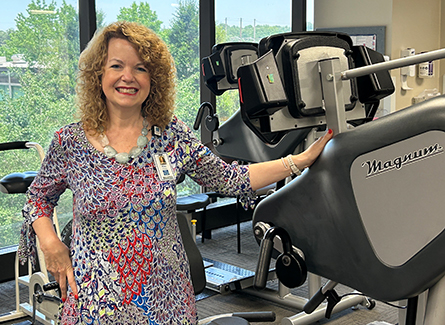 Kimberly Blair next to rehab equipment