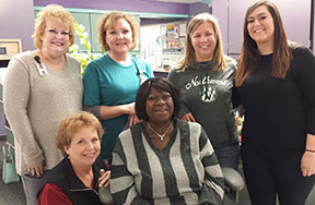 Sharon, center, with her coworkers who nominated her.