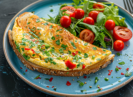 Omelet on toast with vegetable salad